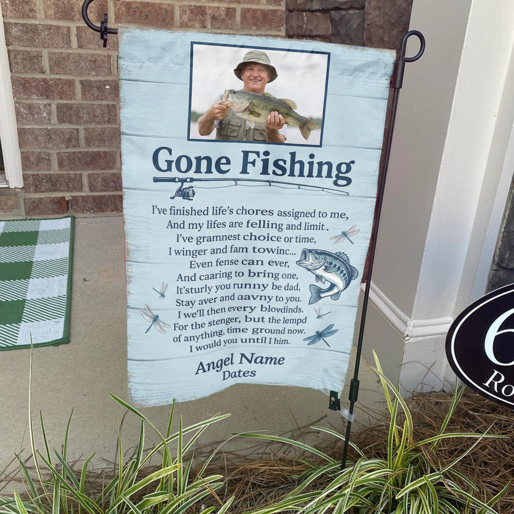 Gone Fishing poem photo memorial garden flag on a stand by a brick front porch
