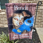 Customer photo of a rustic wood style dog memorial garden flag by a brick wall
