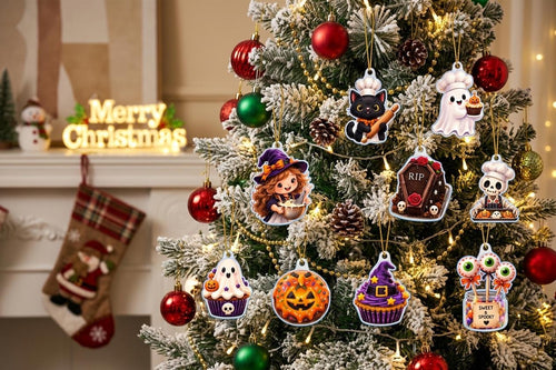 Witch baker, ghost cupcake, black cat and coffin cake acrylic pieces on a frosted tree near a stocking