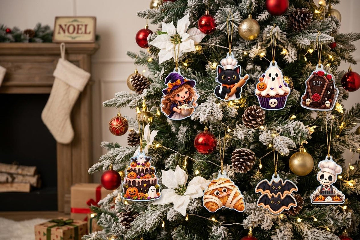 Witch baker, black cat, bat cookie and mummy croissant acrylic pieces on a tree with white poinsettias