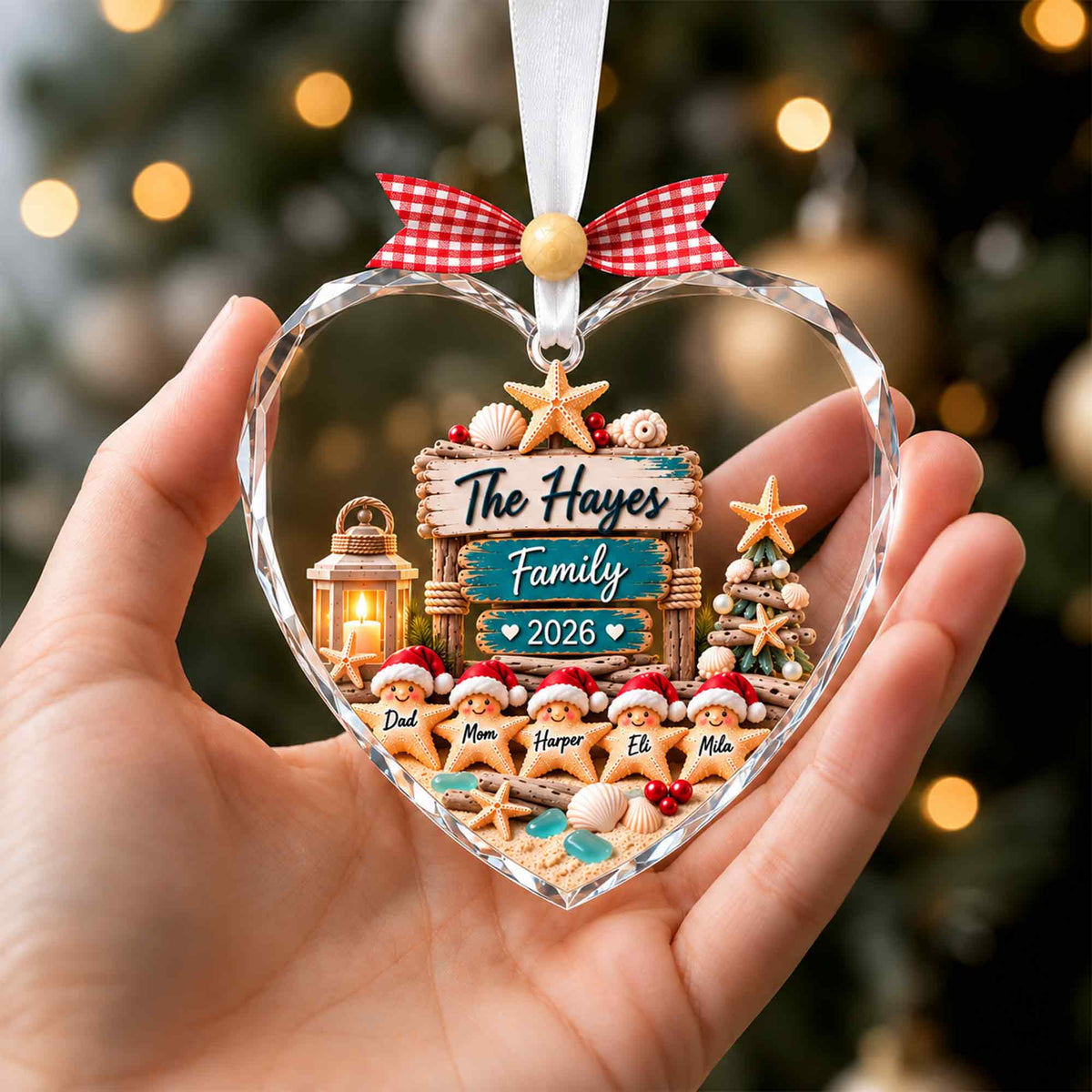 Heart-shaped personalized sea glass family ornament held in hand