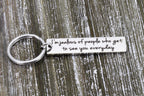 Back of the keychain engraved with I'm jealous of people who get to see you everyday