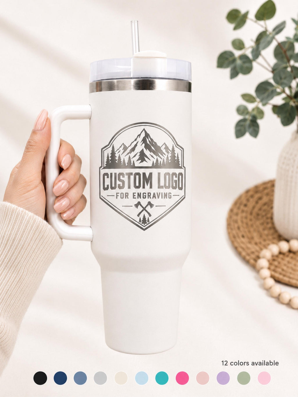 White 40oz handle tumbler laser engraved with a custom business logo