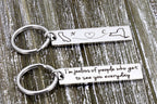 Long distance keychain with California and New York outlines, initials N and C, and a back message