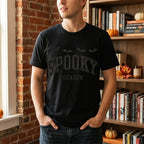 Man wearing a black Spooky Season embroidered t-shirt
