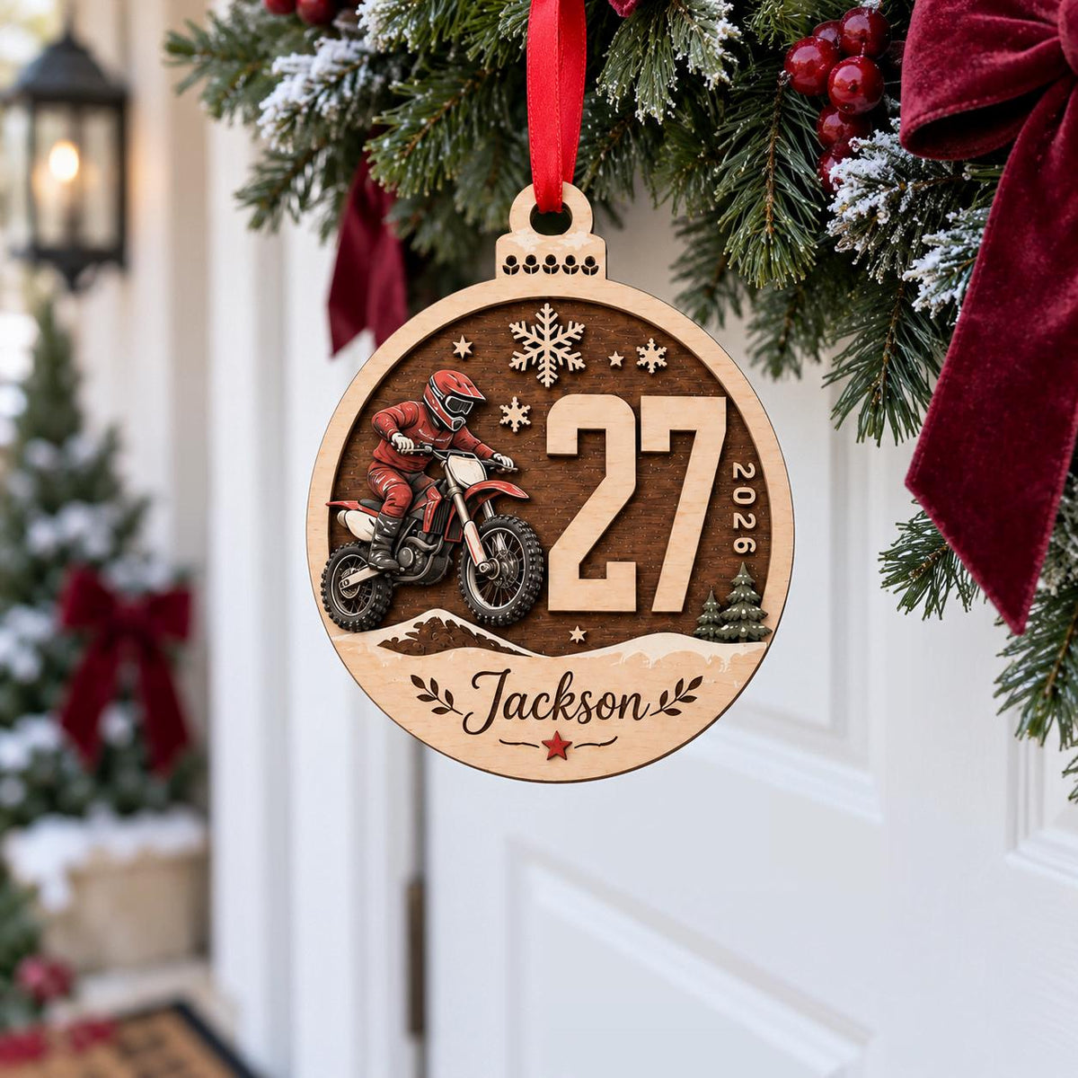 Personalized motocross race number wooden ornament hanging on a wreath by the front door