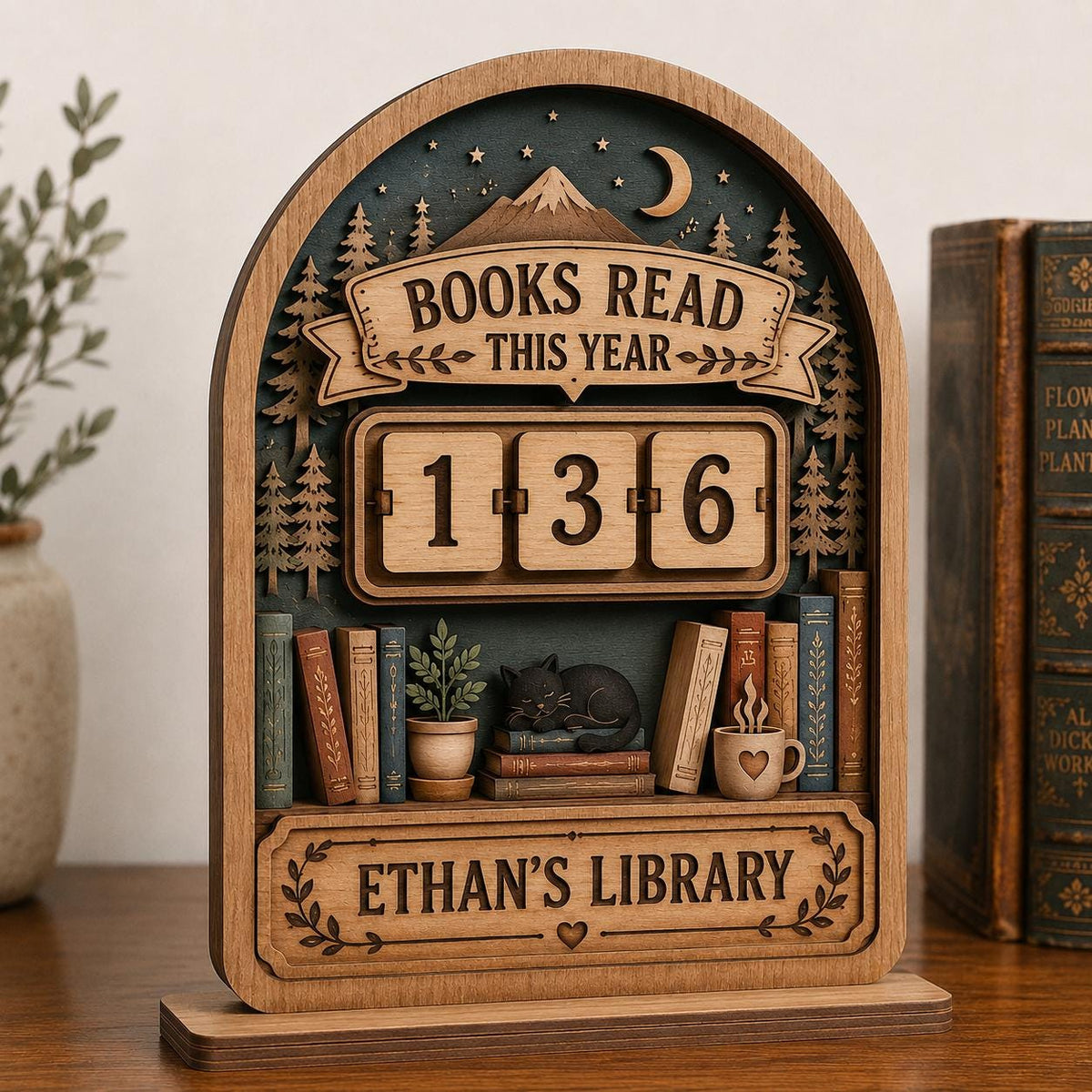 Ethan's Library mountain forest book tracker with a sleeping black cat and heart mug, next to old hardcover books