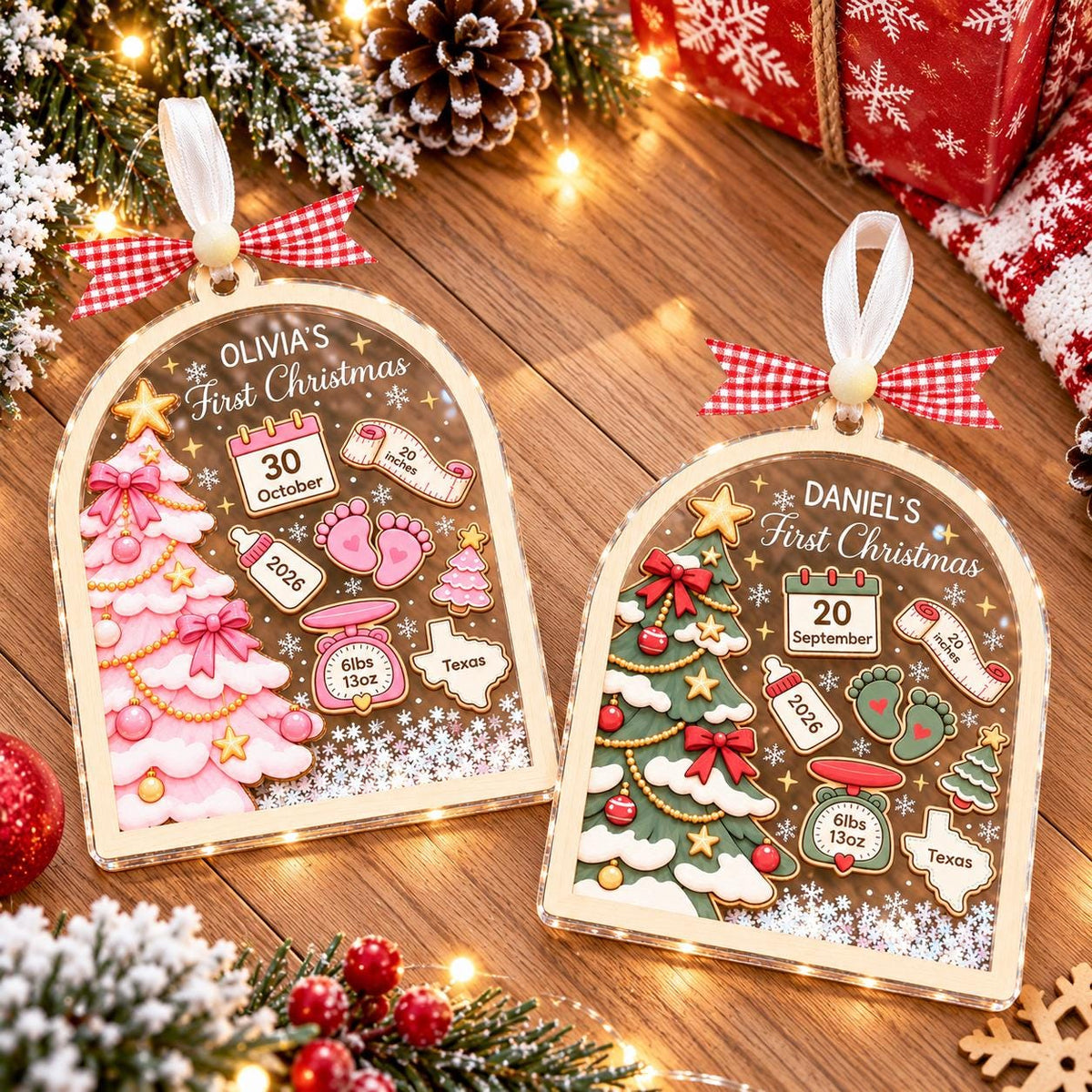 Pink and green newborn keepsake ornaments on a wooden table