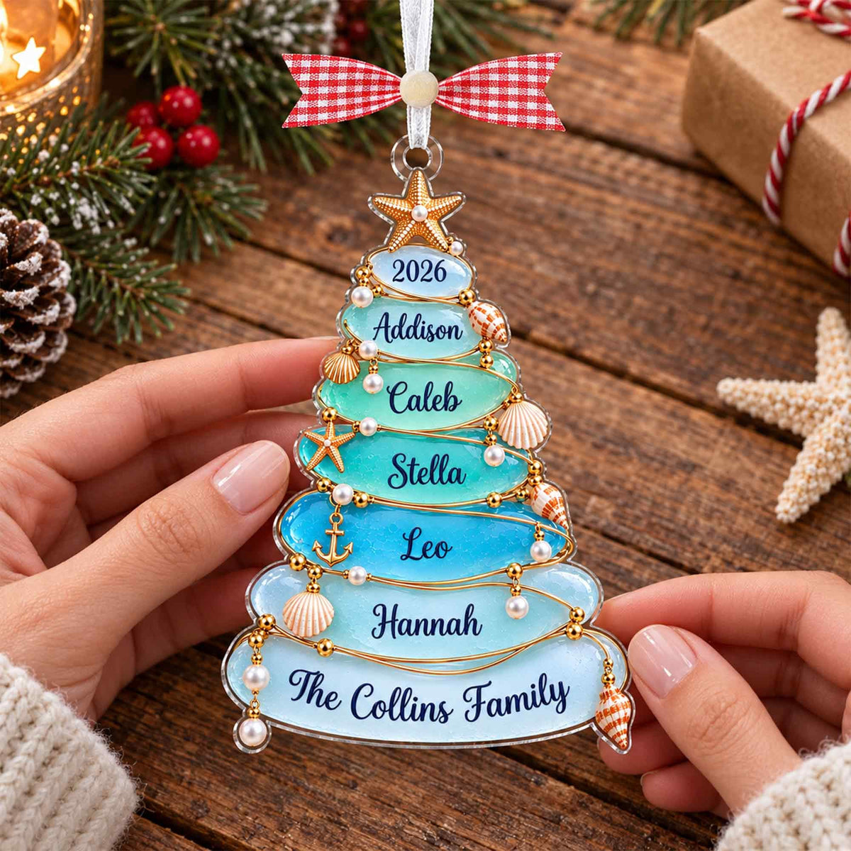 Sea glass tree ornament with The Collins Family held in two hands