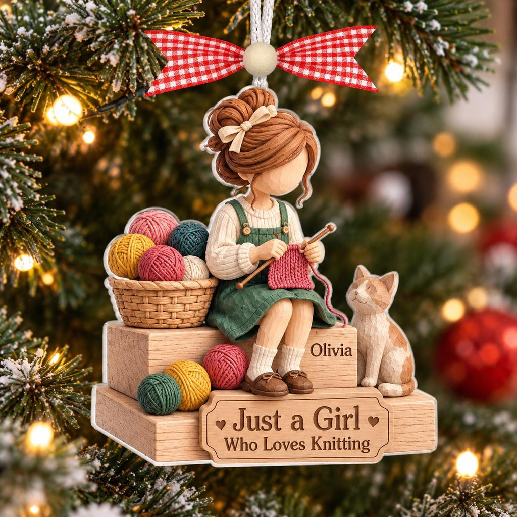 Knitting girl with cat ornament with Olivia on a Christmas tree