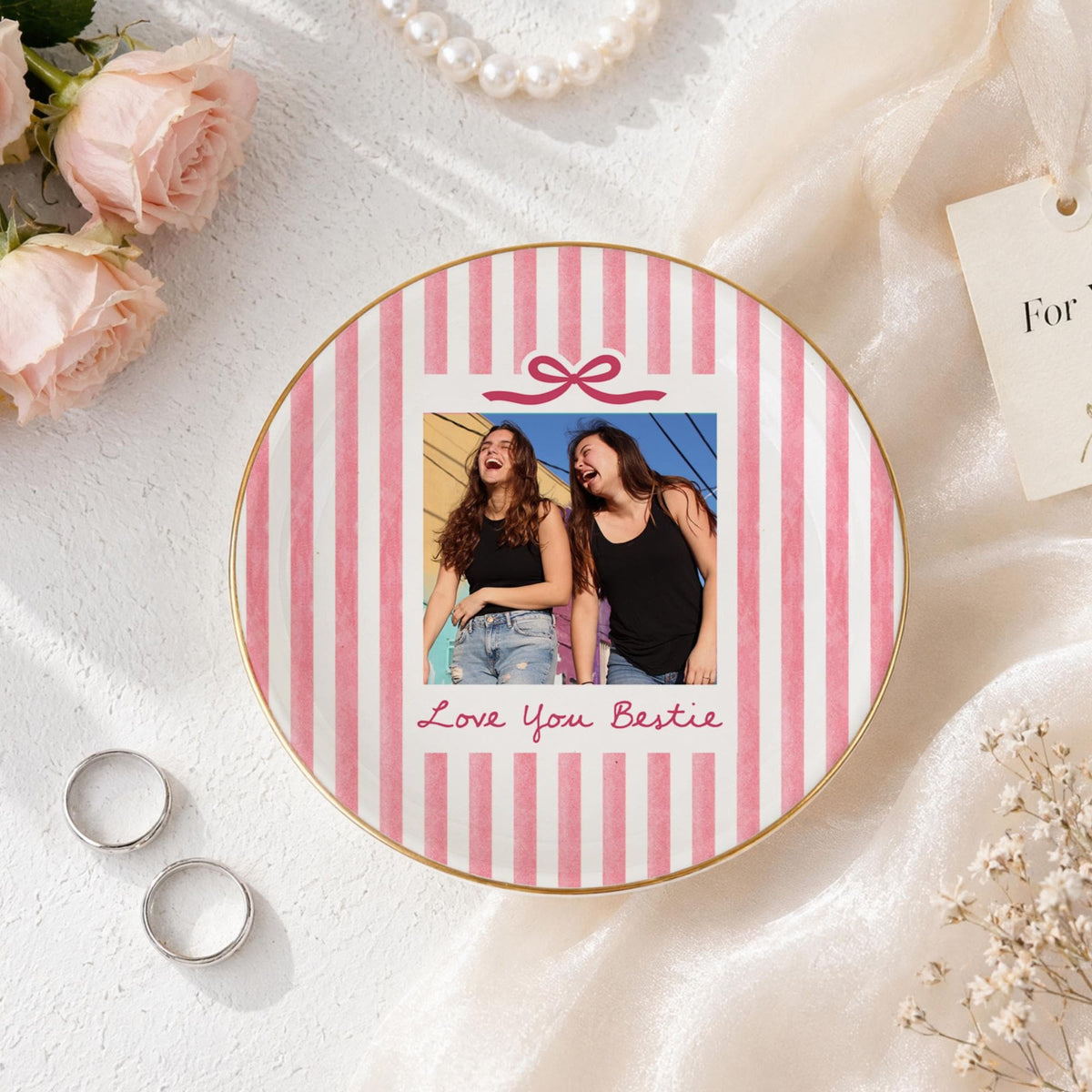 Pink striped round gold rim photo dish with a bow and the words Love You Bestie