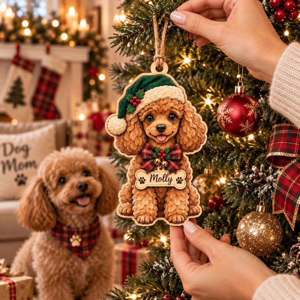 Hands hanging a personalized poodle ornament on the tree beside a real poodle