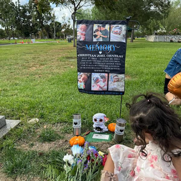Customer photo of a photo collage memorial garden flag at a grave site