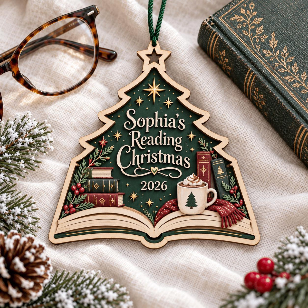 Reading Christmas tree wooden ornament on linen beside a book and glasses
