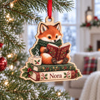 Reading fox wooden ornament with cocoa mug and name on a Christmas tree