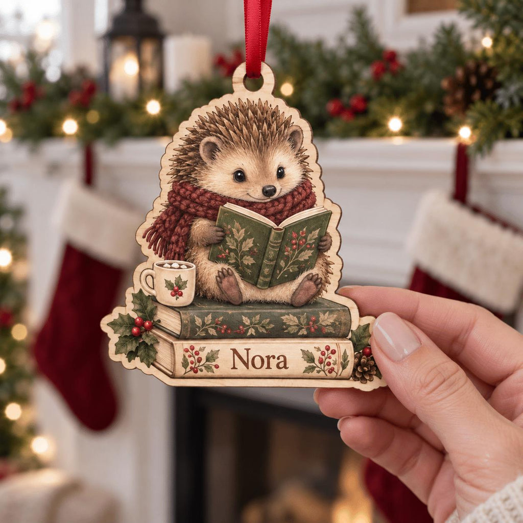 Reading hedgehog book lover wooden ornament with name held by a fireplace with stockings
