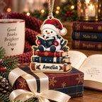 Reading snowman name ornament for book lovers displayed with books and a wrapped gift