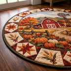 Close-up of the red barn scene with pumpkins, fence and hay, framed by star quilt blocks and wheat bundles
