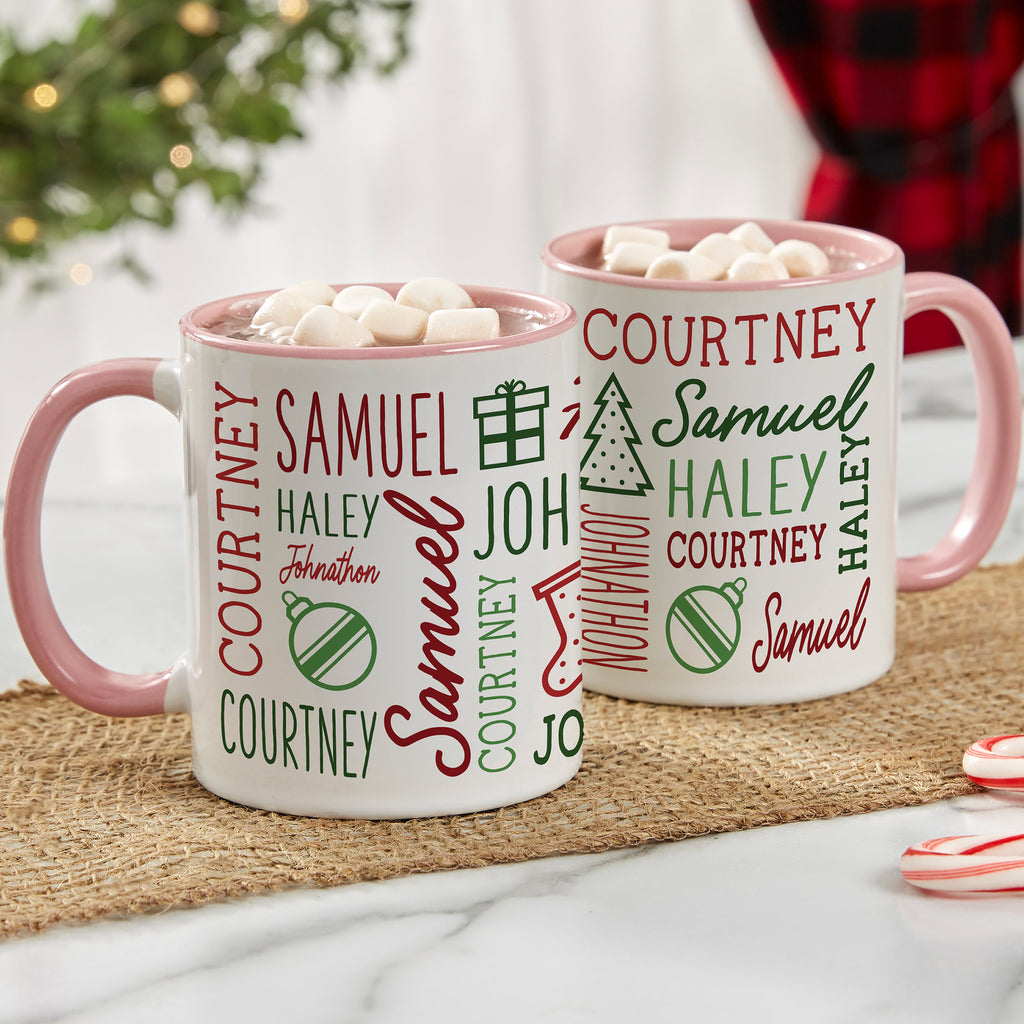 Pink handle Christmas mugs printed with several family names in red and green