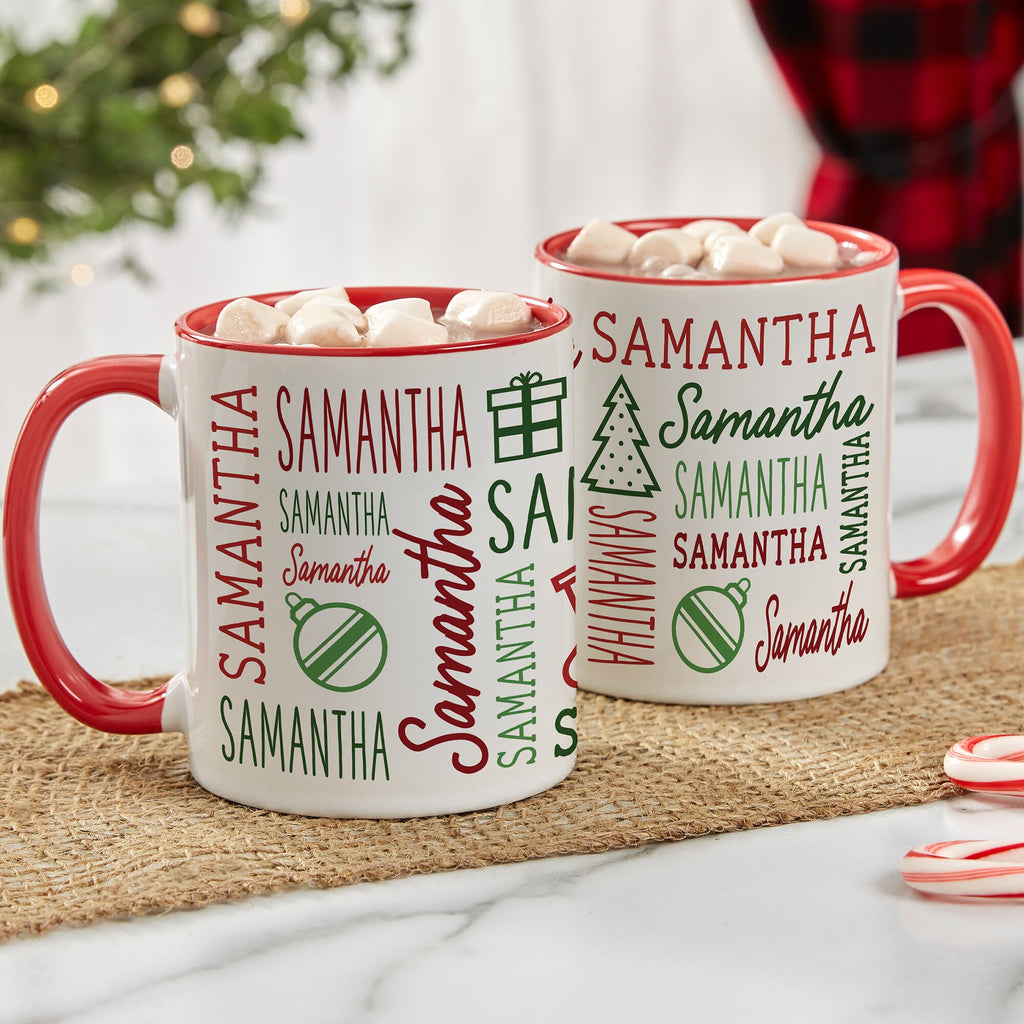 Red handle Christmas mugs printed with the name Samantha repeated with holiday icons