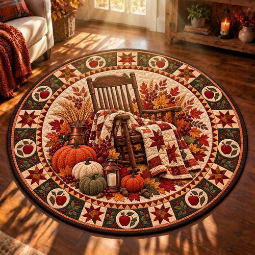 Autumn rocking chair quilted rug with pumpkins and an apple border in warm sunlight and window shadows
