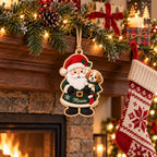 Personalized Santa and puppy wooden ornament hanging from a mantel above a fireplace
