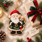 Santa and puppy name wooden ornament laid beside a wrapped gift and holiday tag