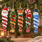 Five spiral Christmas ornaments hanging from a garland