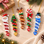 Five spiral ornament designs with names and 2026 hearts on a wood table
