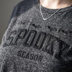 Close-up of the tone-on-tone Spooky Season embroidery with bats