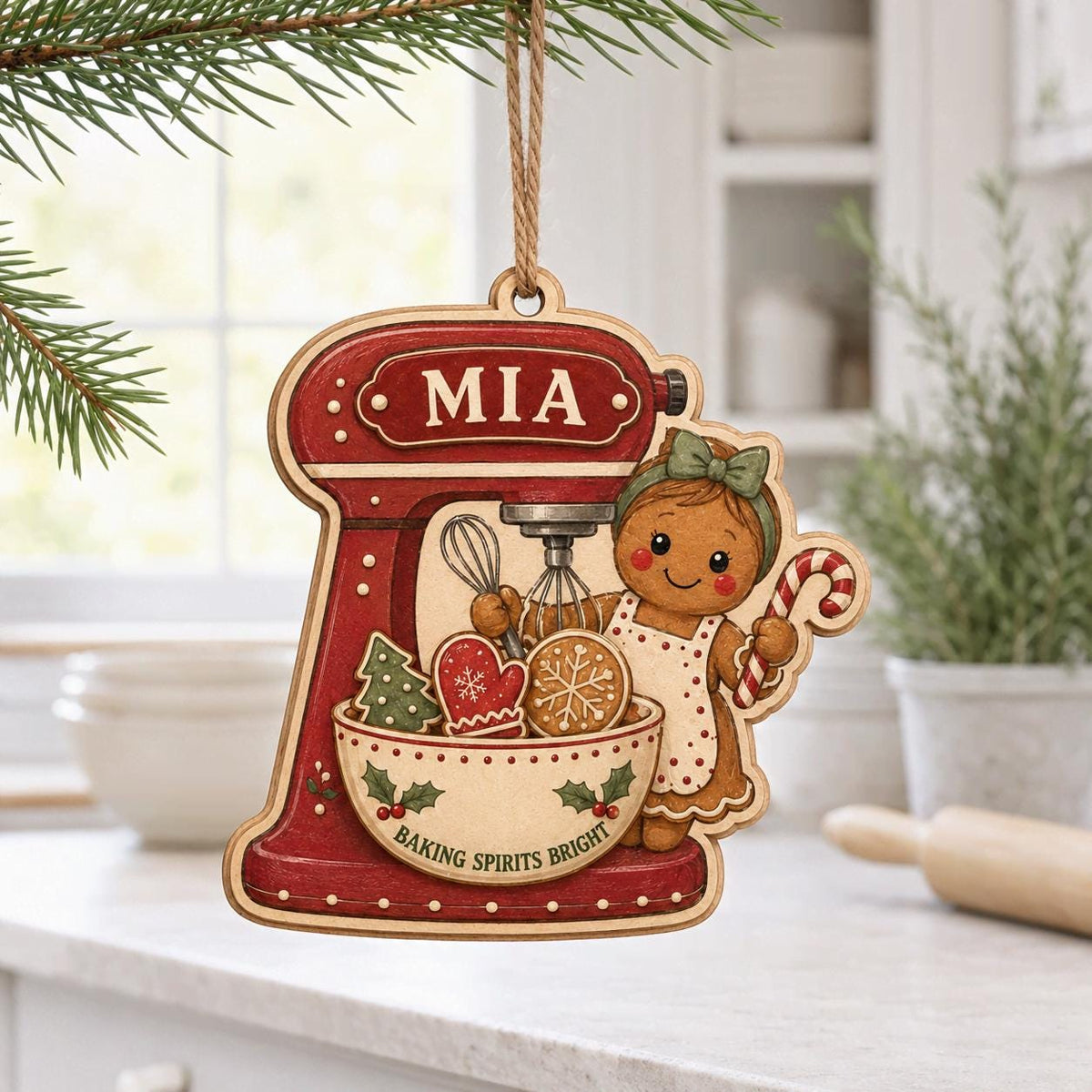 Personalized red stand mixer ornament with gingerbread girl and name in a kitchen