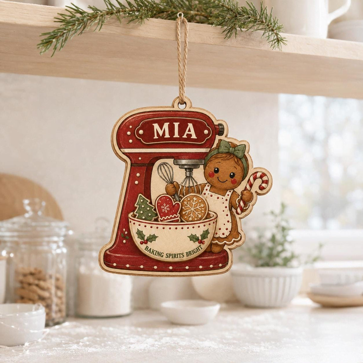Personalized baking ornament with mixer and cookies hanging over a kitchen counter