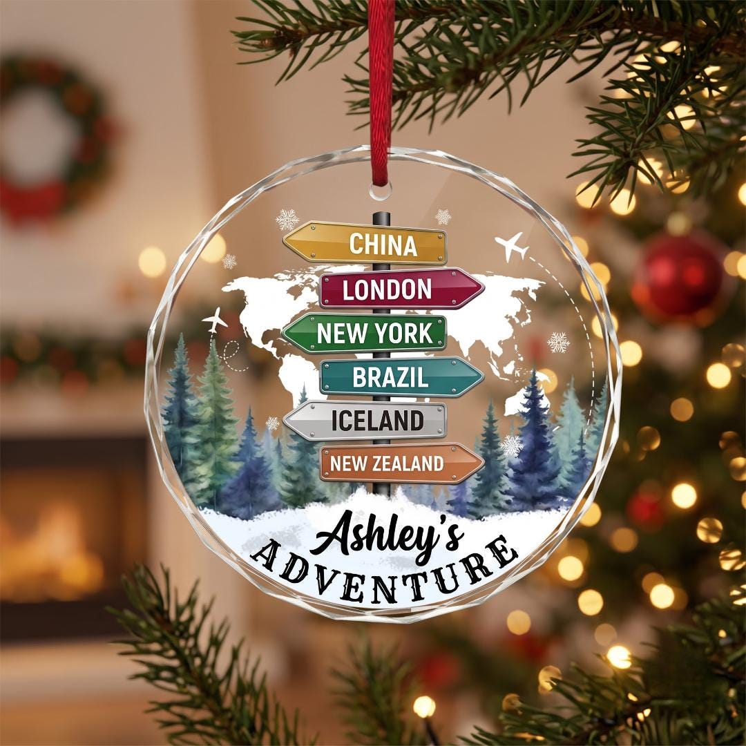 Personalized travel adventure glass ornament with a destination signpost and Ashley's Adventure