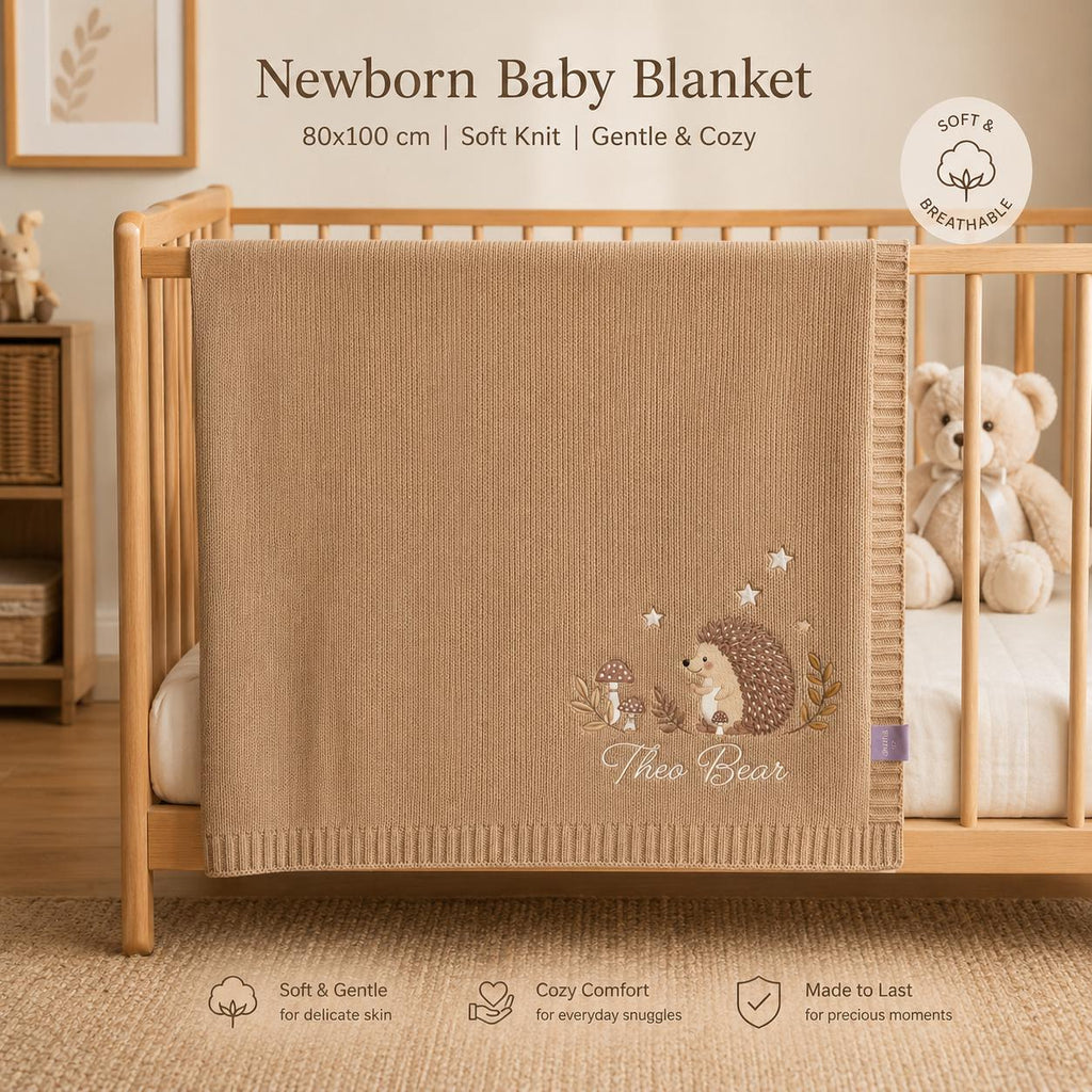 Brown hedgehog name blanket hanging on a crib with text noting a soft knit newborn blanket, gentle and cozy