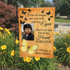 Yellow butterfly I Will Feel You In My Heart photo memorial garden flag in a garden bed with yellow lilies