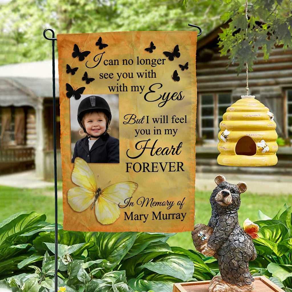 Yellow butterfly I Will Feel You In My Heart photo memorial garden flag on a garden stand by a log cabin with a beehive and bear statue