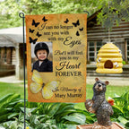 Yellow butterfly I Will Feel You In My Heart photo memorial garden flag on a garden stand by a log cabin with a beehive and bear statue